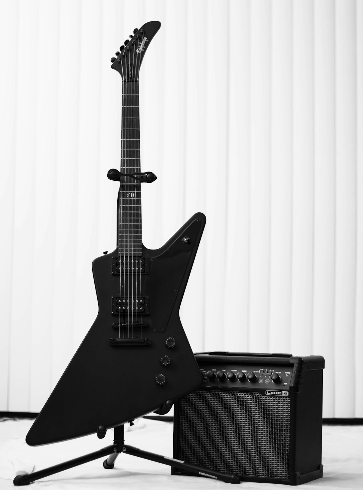 An acoustic guitar produces sound through vibrating strings
