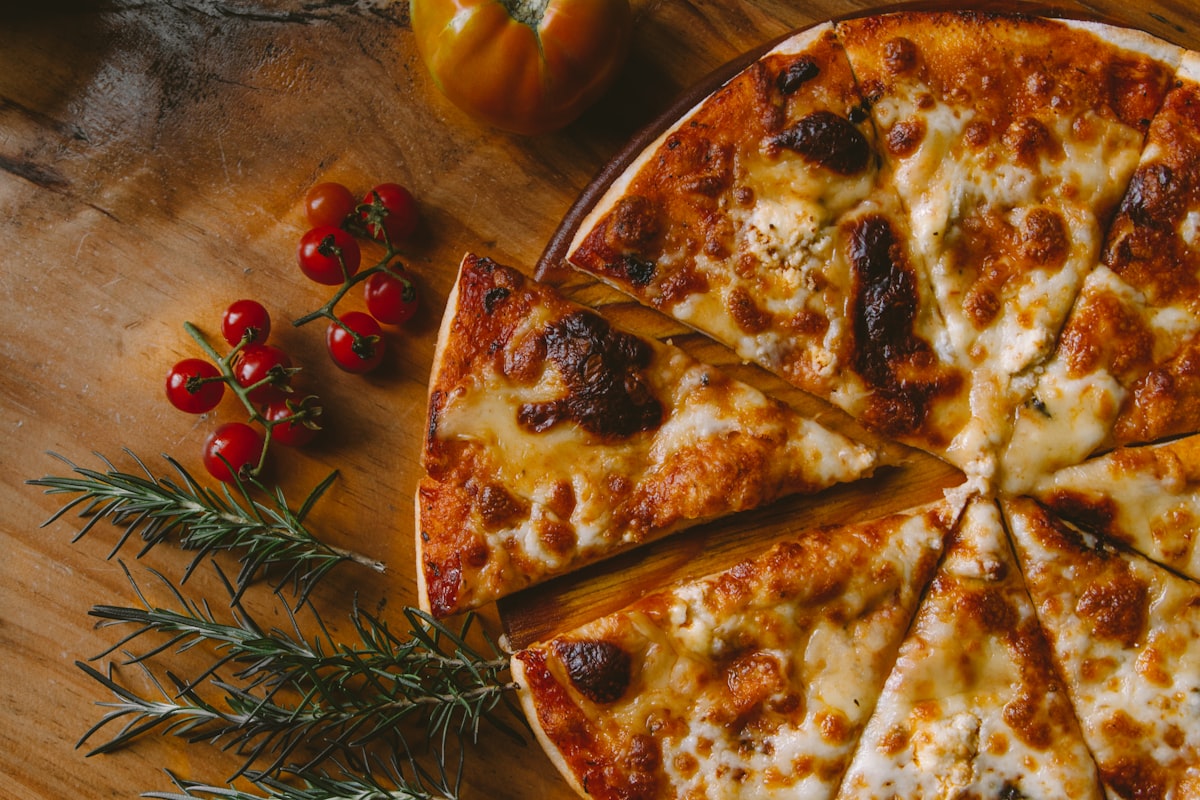 A pizza divided into equal slices illustrates fractions in action