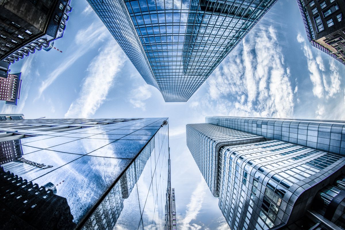 A laptop represents the digital infrastructure of modern finance